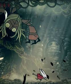 A giant bug with huge arms and claws suspended from the ceiling in Hollow Knight Silksong